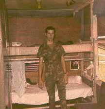 Dan Massola in front of his bunk in hootch 664